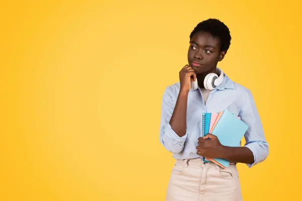 Pensive Young Black Woman Student Holds Her Chin Contemplating Next — Stock Photo, Image