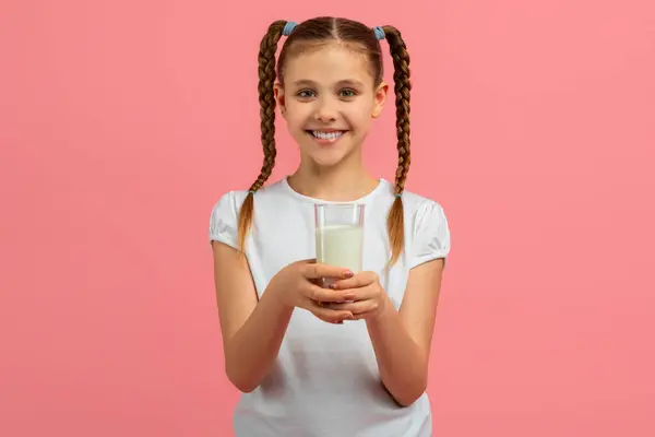 Teen Girl Holds Glass Milk Smiling Pleasantly Isolated Pink Background — Stock Photo, Image