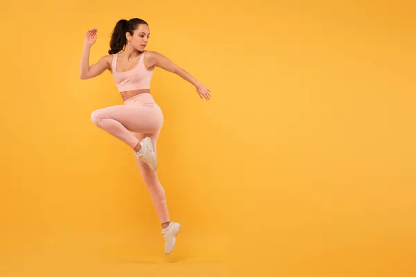 Woman Wearing Pink Outfit Captured Mid Air She Jumps Her Royalty Free Stock Photos