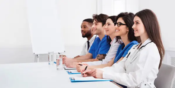 Stock image Medical Seminar. Doctors And Interns Listening To Professor In Conference Room