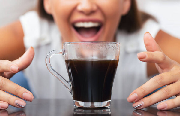 Caffeine Addiction. Unrecognizable Girl Reaching For Cup Of Coffee Indoor. Selective Focus, Cropped