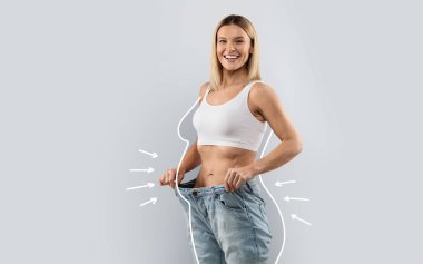 Cheery attractive slender middle aged blonde woman wearing huge jeans, showing results of diet, white body shape lines around happy slim lady, collage for slimming concept, copy space clipart