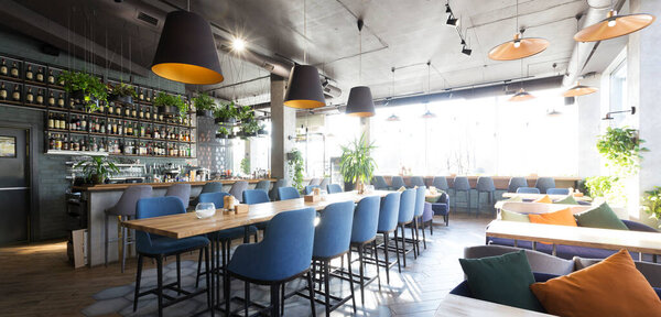 Empty bar counter interior in modern cozy cafe, panorama, copy space