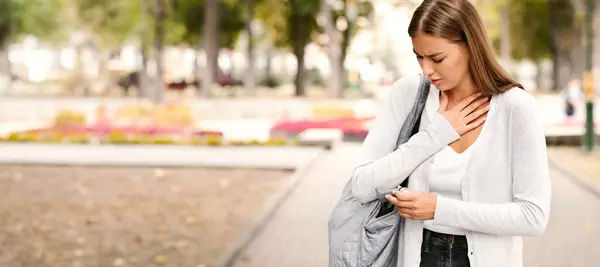 stock image Asthmatic Attack. Girl Reaching For Asthma Inhaler Preventing Respiratory Depression Walking Outdoor.