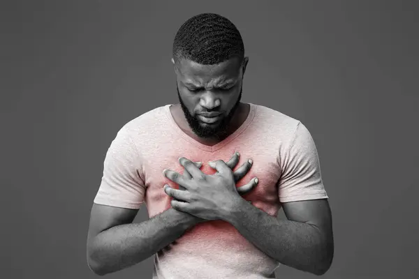 stock image Sad young afro man suffering from acute pain in chest, white background