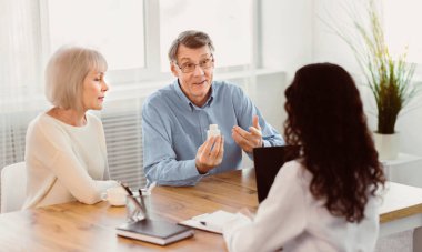 Consult Your Doctor. Senior man asking his nurse about indications and contraindications of new medicine, copyspace