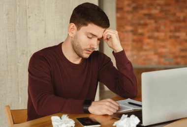 Tired Freelancer Guy Sleeping Sitting At Laptop In Modern Office. Nap At Work Concept. Selective Focus clipart