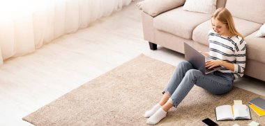 Student Girl Using Laptop, Sitting on Floor at Home, Making Homework, Free Space, top view