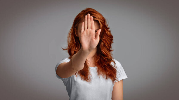 Unrecognizable Girl Gesturing Stop Warning About Danger Standing In Studio Over Gray Background. Panorama