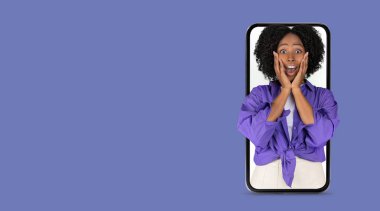 A person with curly hair expresses joy and surprise while looking at a smartphone with a big screen. This moment captures communication and online interaction. clipart