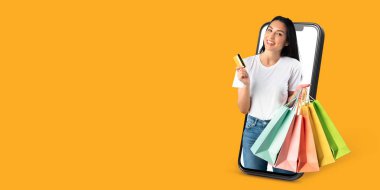 Bir müşteri büyük bir akıllı telefon ekranı ile iletişim kurarken bir kredi kartı ve alışveriş torbası tutar. Canlı arka plan online alışverişin heyecanını vurguluyor.