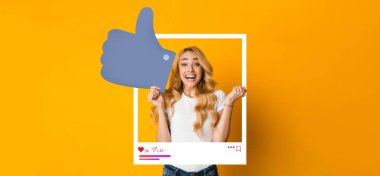 Genç bir kadın, parlak sarı bir arkaplan önünde başparmak kaldırarak sevinçten havalara uçar. Hevesli duruşu sosyal medyanın ilgisini ve ilhamını çekiyor..