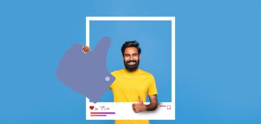 Sarı tişörtlü gülümseyen bir adam mavi arka planda duruyor, olumlu bir hareket sergiliyor. Sosyal medya bağlılık ve içerik oluşturma ruhunu somutlaştırıyor..