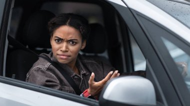 Negative human expression, traffic jam and rule breaking in road. Displeased, angry, pissed off, emotional woman driving car, look at someone, gesturing because of incident on road, empty space