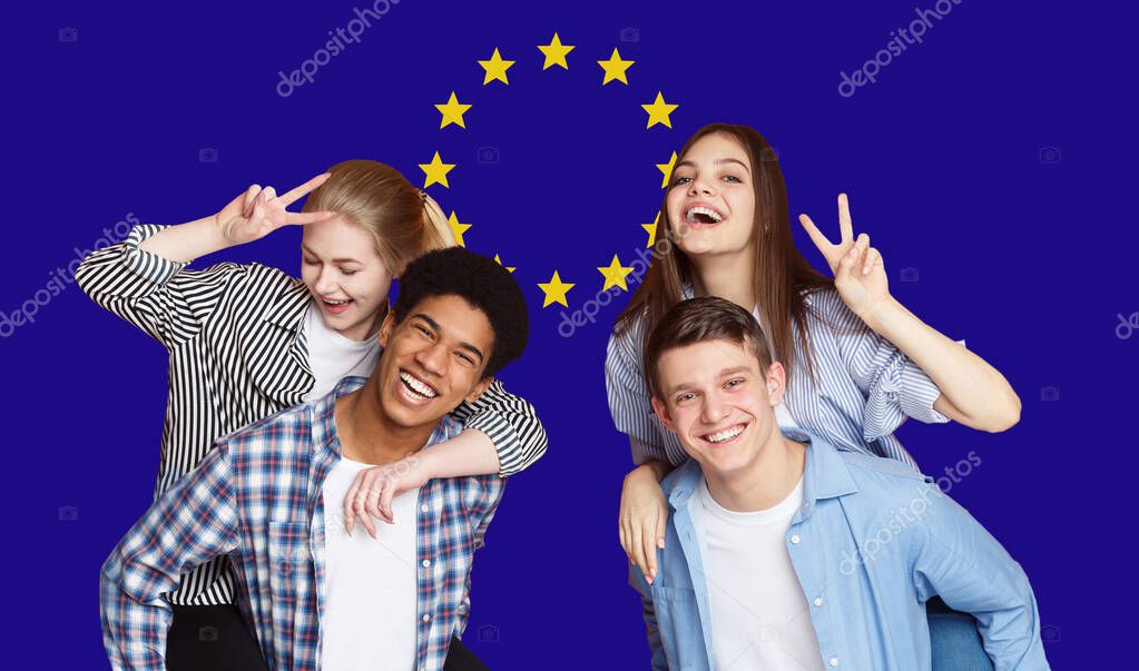 Group Of Happy Multi Ethnic Students Standing Over EU Flag Background, Cheerful Teens Enjoying Education In Europe Union, Panorama