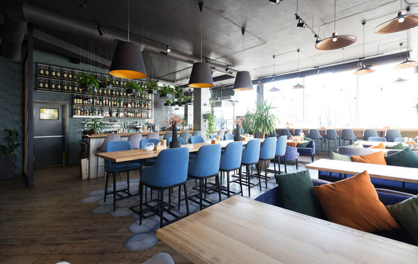 New and clean luxury restaurant in european style, bar counter, copy space, no people, quarantine, world pandemic