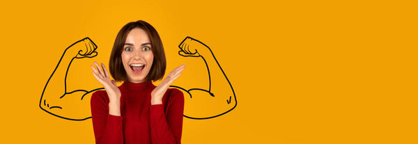 A woman celebrates her strength with an enthusiastic expression, showcasing her biceps against a vibrant yellow background. This energetic display emphasizes confidence and empowerment.