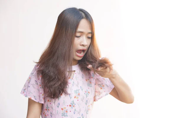 Asian woman shocked to see damaged hair
