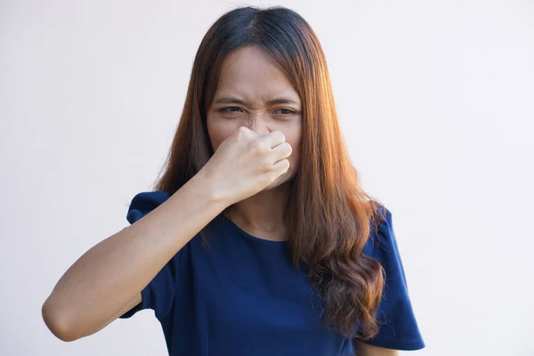 Asian women cover their noses with their hands because they smell bad.