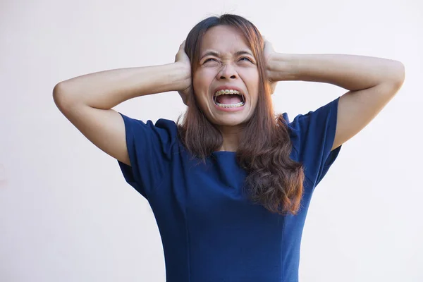 Asian women suffer from work stress. Put your hand on your head