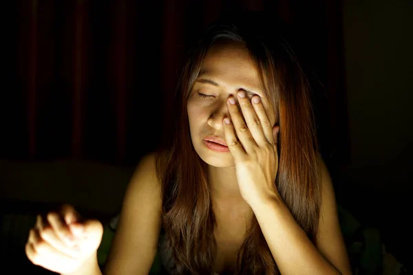 Asian women suffer from eyestrain from looking at computers in low light. watch movies online