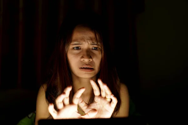 Asian women suffer from eyestrain from looking at computers in low light. watch movies online