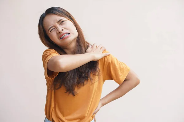 Asian woman having shoulder pain