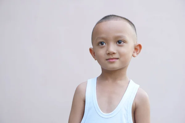 stock image Asian boy smiling happily room wall background