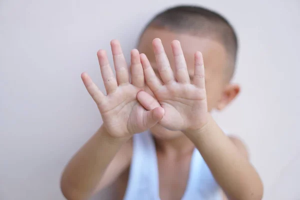 stock image Boys raise their hands to prevent violence against children.