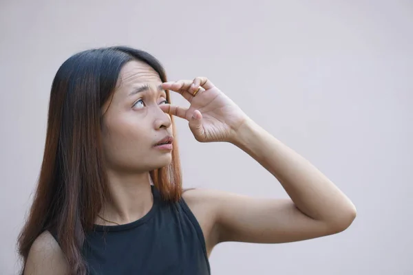 Asian woman has sore eyes