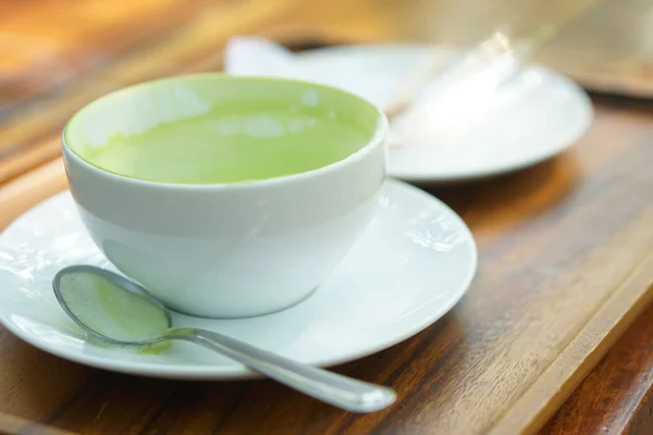 stock image Hot green tea in a finished cup