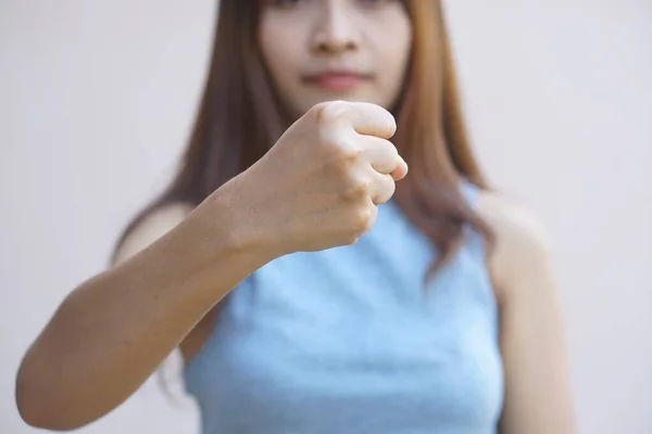 stock image Women raise their fists to let them know they are fighting.