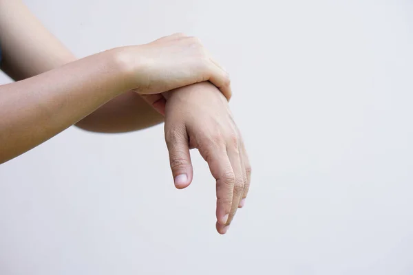 Stock image A woman has muscle weakness in the arms and hands.