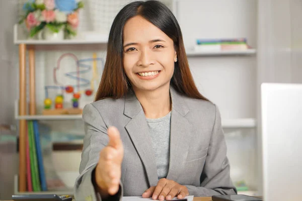 happy smiling business woman Reaching out after reaching a business deal