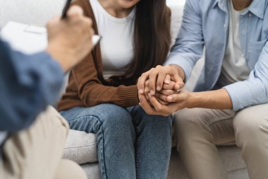 couple relationship therapy with a counselor. Close Up hands of the woman client during a conversation with psychologist to find problems and solution.