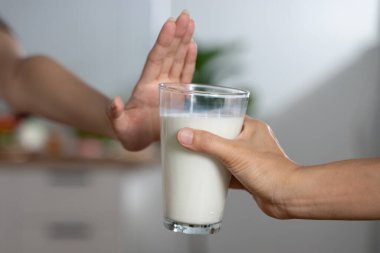 person deny to drink milk because lactose tolerance