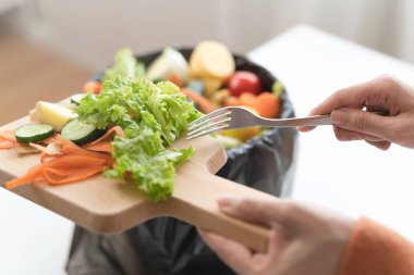 people put bio trash from food waste in domestic homes to compost bins to make fertilizer to reduce global environmental pollution.