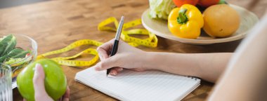 person take note of weight and counting of calories to eat in each day