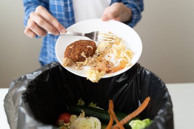 people put bio trash from food waste in domestic homes to compost bins to make fertilizer to reduce global environmental pollution.