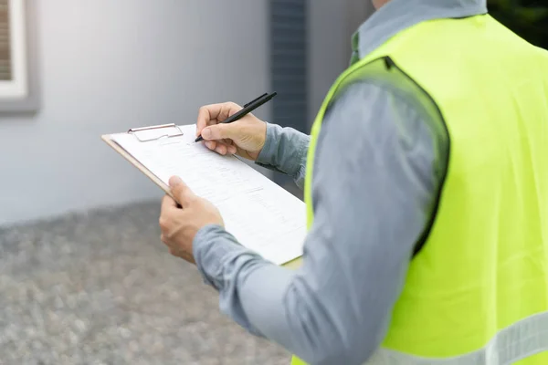 Builder inspection consultancy. Inspector checking material and structure in construction.