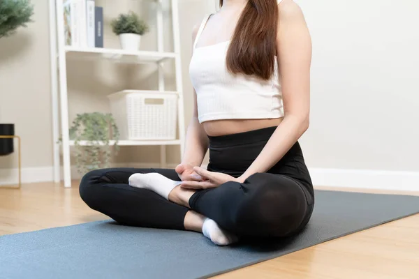 Routine health wellbeing concept. Woman doing meditation at home for practice her mindfulness pose lotus hand and breathing care.