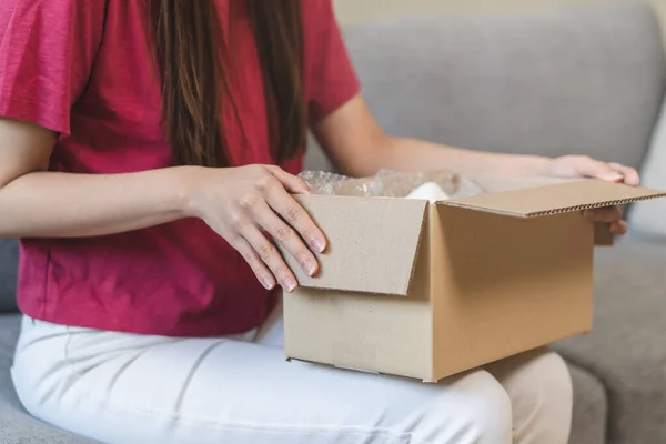 Close View Hands Young Woman Opening Cardboard Box Sofa — Stock Photo, Image