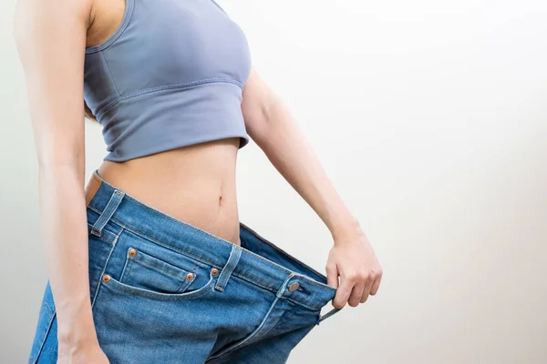 Person Wearing Oversized Old Jean Pants Weight Loss Success Isolated — 스톡 사진
