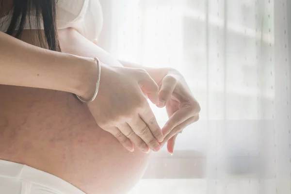 Pregnant Women Wear White Underwear Touching Her Belly Her Hands — Stockfoto