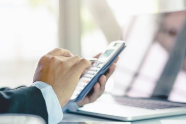 entrepreneur calculate financial cost. Businessman planning to extend business and calculating budget for develop and prepare to talk with bank to request financial loan.