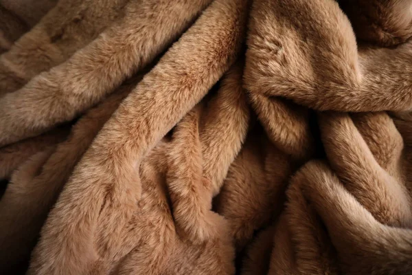 Brown plush fabric. Delicate soft background of plush fabric