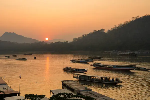 stock image Wooden Boats at the Mekong River of Luang Prabang in Laos Southeast Asia during the Sunset Time