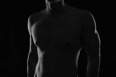 Shirtless muscular male body.Black and White Low Key Photography