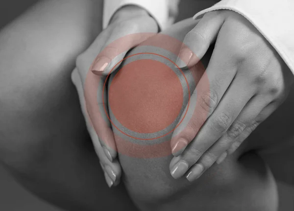 Knee pain close up. Pain relief concept