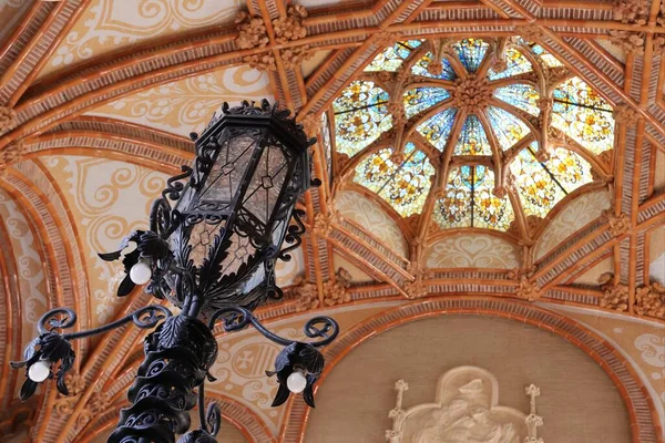 Mosaic ceiling and a lamp inside of Hospital Sant Pau Complex, Barcelona, Spain